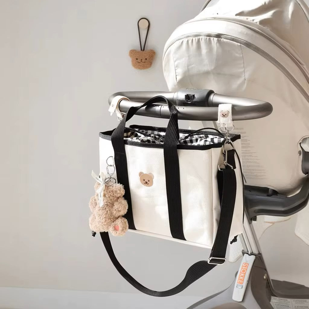 sac à langer en toile avec cordon ajustable sur poussette